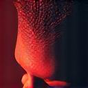 男性の顔の血行が良い状態をイメージした抽象的なグラフィック。生き生きとした、若々しい肌の輝きを表現。